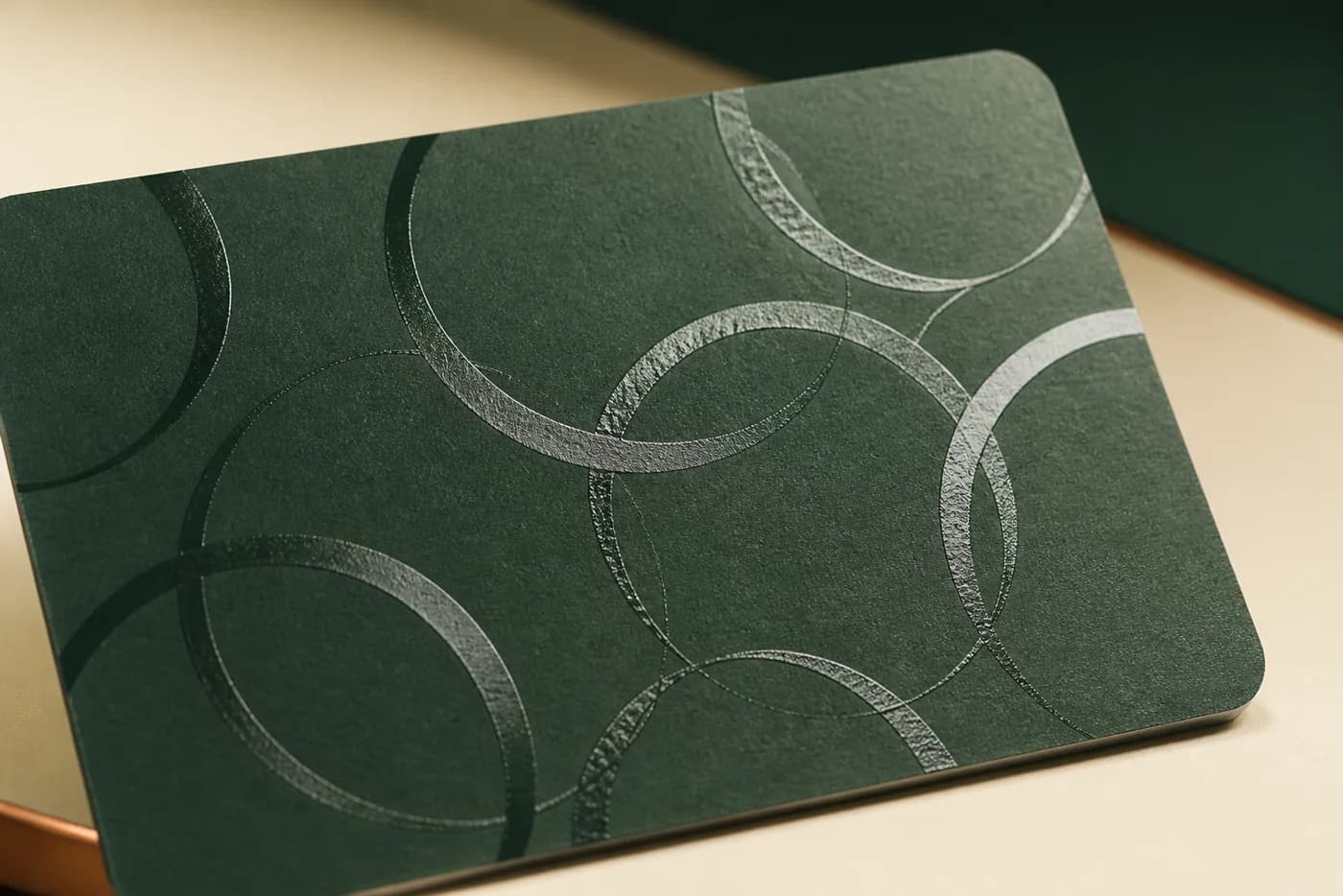 Gloss spot UV circles on matte dark green paperboard